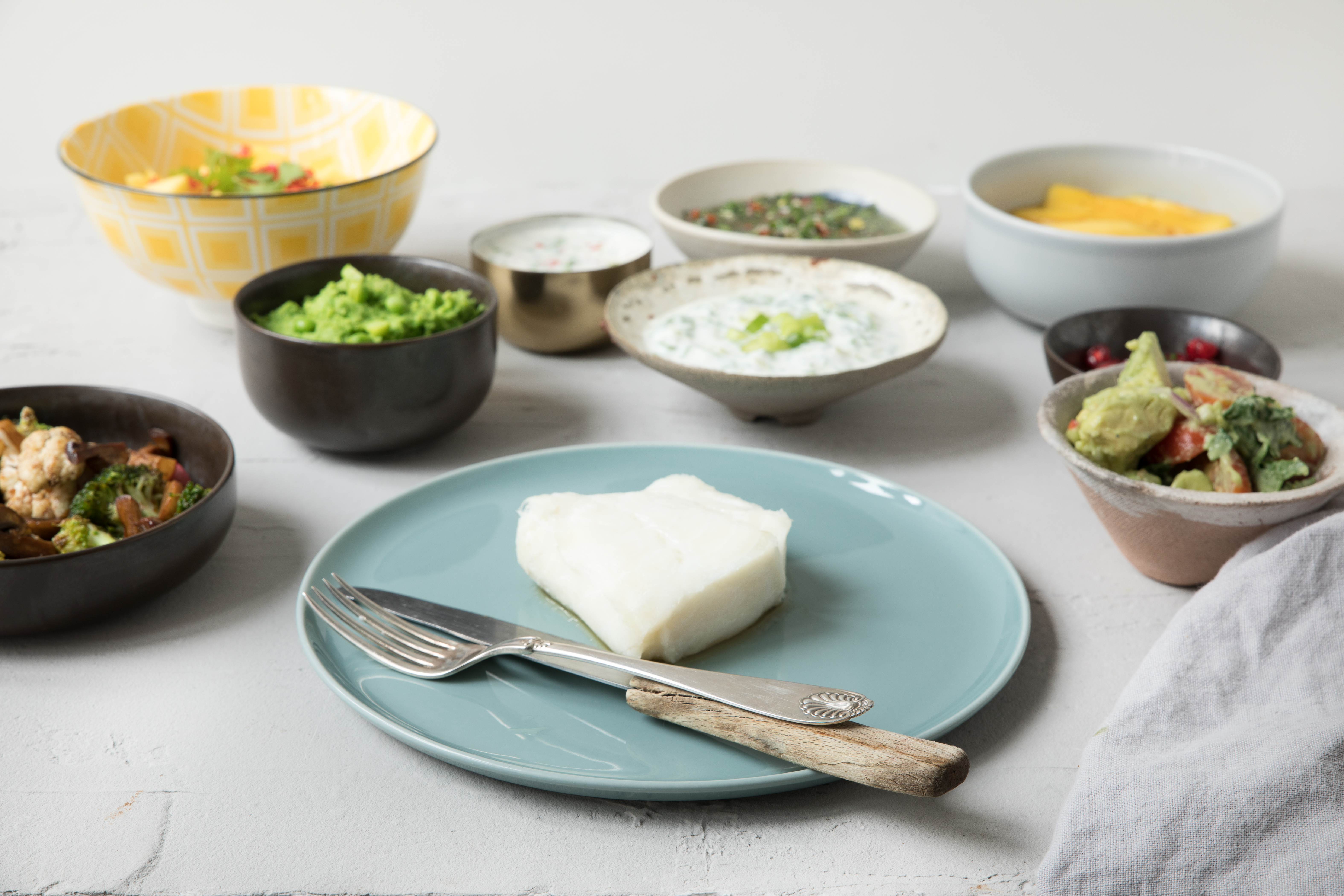 Block with cod on a plate